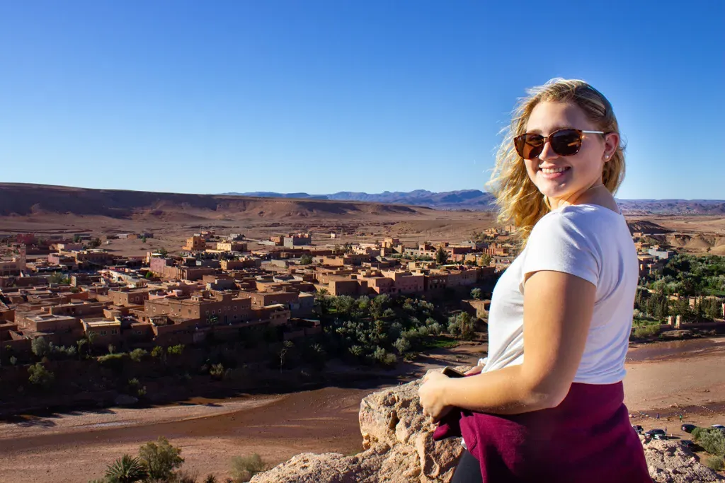 a female student overlooks a village